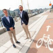 Two men standing on the quays along cycle route in Dublin.
