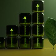 Leaf beside dice indicating ESG progress.