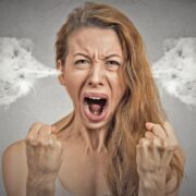 Stressed executive with smoke coming from her ears.