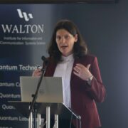 Woman speaking at podium.