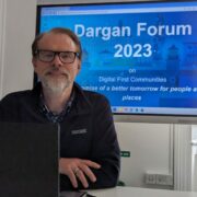 Man in front of a blue screen.