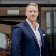 Man in navy suit.