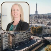 Woman in black jacket inset on image of Paris, France.