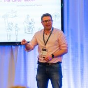 Man speaking on stage.