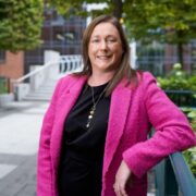 Woman in pink jacket.