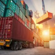 Shipping containers being loaded.