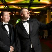 Two men with an award.