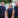 Two men and a woman wearing navy t-shirts.