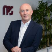 Man in navy suit jacket.