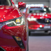 New red cars in a showroom.