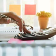 accountant using calculator.