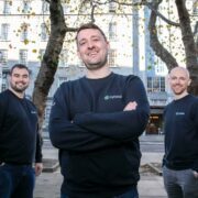Three men in navy sweatshirts.