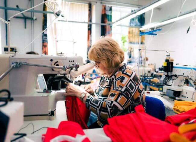 Woman making clothing.