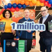 Woman and two men in a supermarket.