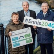 Woman and two men by a river in Ennis.