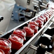 Jars of food on a conveyer belt.