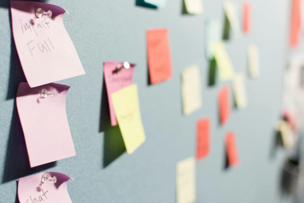 Post-it notes on a wall for planning content strategy.