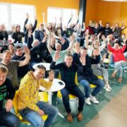 Large group of colleagues celebrating.