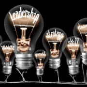 Lightbulbs with words leadership and strategy in the filament.