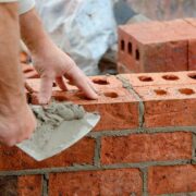 Bricklayer at work on construction site.