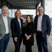 Two men and two women on a balcony in Dublin.