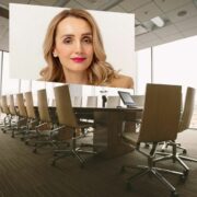 Woman inset on image of corporate boardroom.