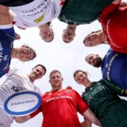 Group of rugby players from Ireland's four provinces in a circle.