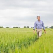 Man walking in field.