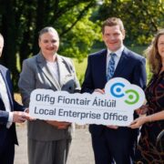 Two men and two women holding a Local Enterprise Office sign.