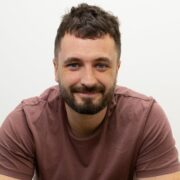 Man wearing brown t-shirt.
