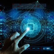 Finger touching an advanced AI chip.