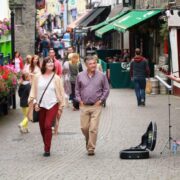 Man and woman walking through Kilkenny city.