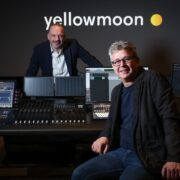 Two men in a recording studio.