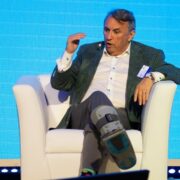 Man sitting on white chair.