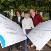 Student entrepreneurs with their prize-winning cheques.