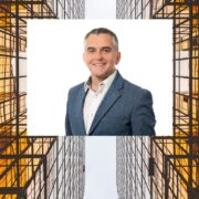 Man inset on image of square buildings.