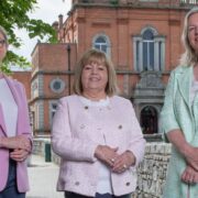 Three women at a bridge in Newry.