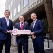 Three men in front of a building in Dublin.
