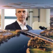 Man in lab inset on panoramic aerial view of Galway city.