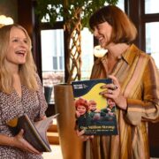 Two business women at an event.