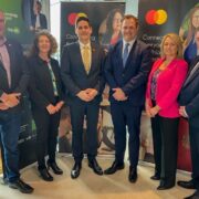 Four men and two women in business attire.