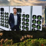 Man in power station inset on image of mountains around Taiwan.