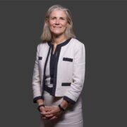 Woman in white business suit.