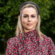 Woman in floral blouse.