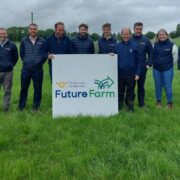 Large group of men standing in a field.