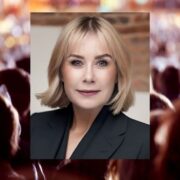 Fair-haired woman inset on image of a vast crowd.