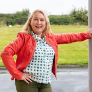 Woman in red jacket.