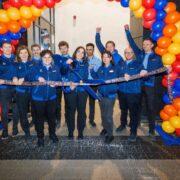 ALDI staff cut ribbon on a new store.