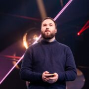 Man speaking on stage at Slush.
