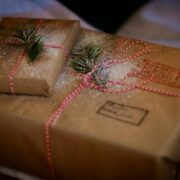 Christmas presents wrapped in brown paper.